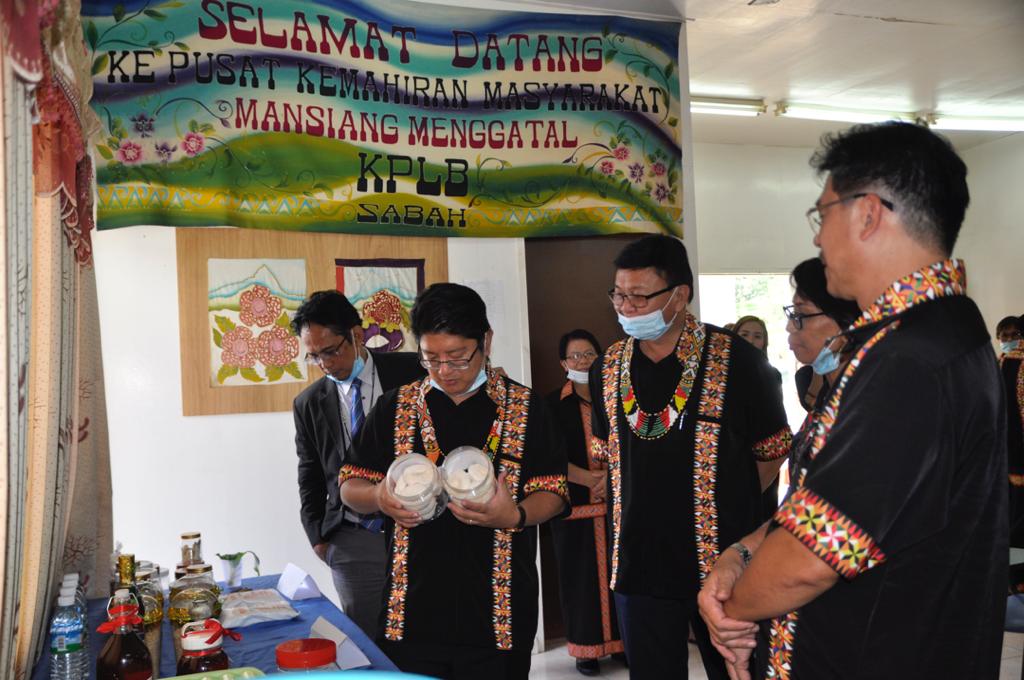 Sabah Minister Datuk Ewon Benedick looking at traditional food.